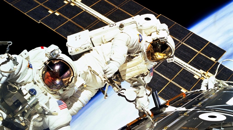 Astronauts spacewalk building the ISS