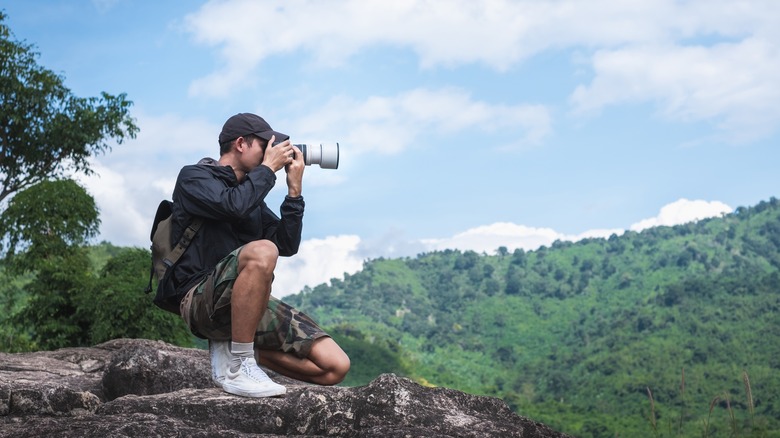 Outdoor photographer on cliff