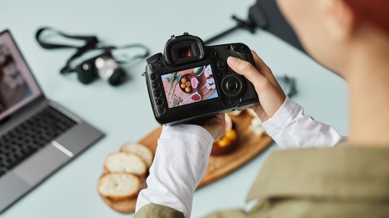 Photographer taking pictures of food