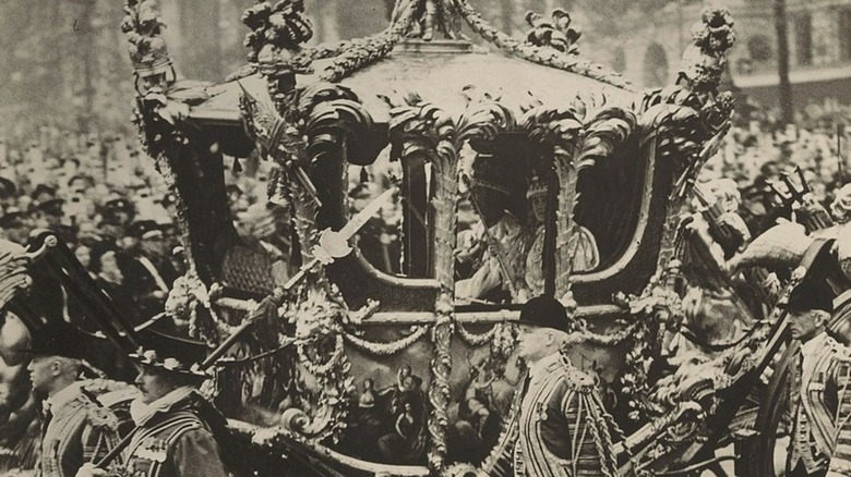 King George VI being filmed in a carriage after the coronation