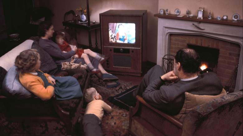 a family watching color TV