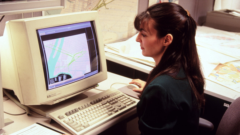 90s woman using computer