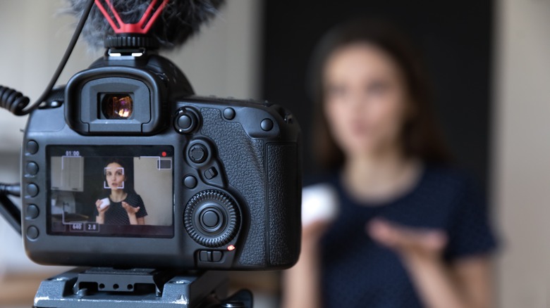 Woman speaking into camera