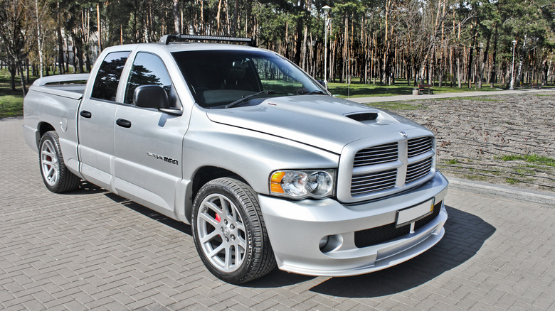 A gray 2004 Dodge Ram SRT-10 parked in a brick driveway