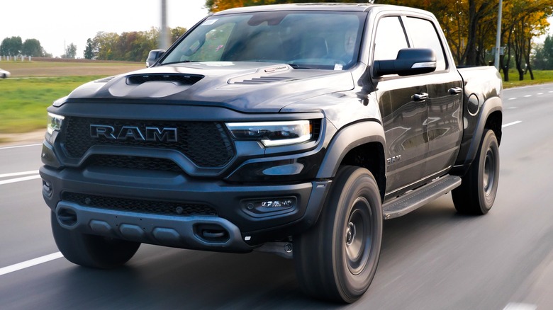 A black RAM TRX driving on a highway