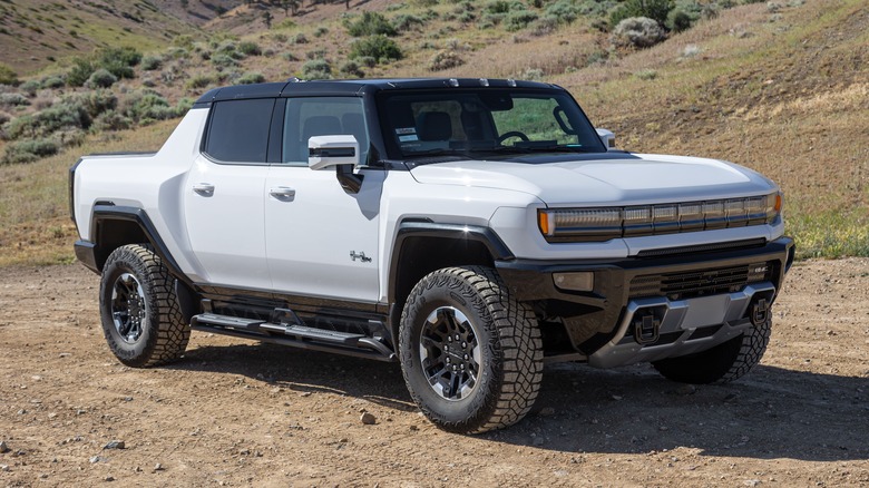 A white 2022 GMC Hummer EV in the desert