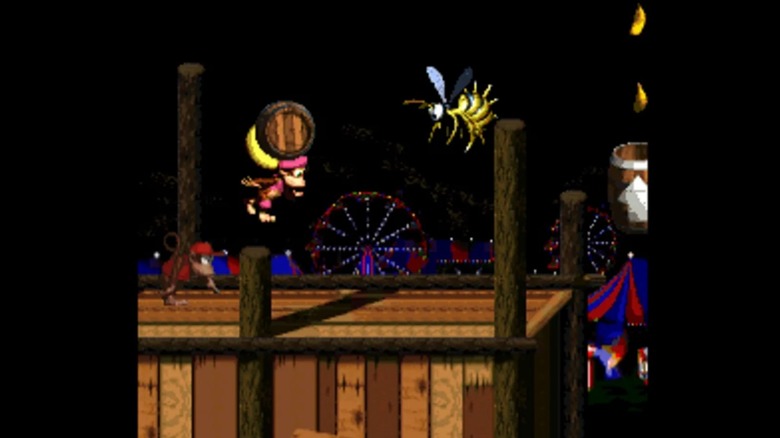 Dixie Kong holding a barrel with her pony tail