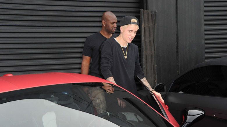 Justin Bieber gets out of his Ferrari 458 Italia