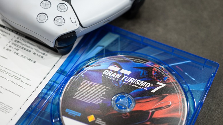 PS5 controller and Gran Turismo 7 game