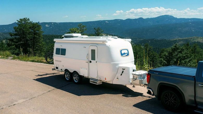 Oliver Travel Trailer parked behind a truck