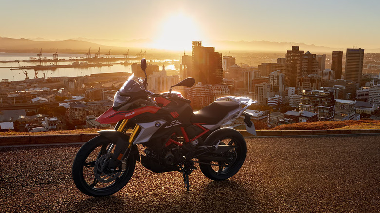 BMW G 310 GS at sunset overlooking a city