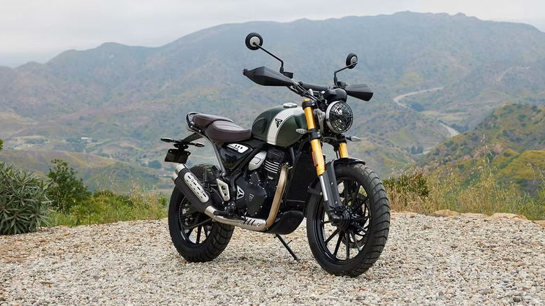 Triumph Scrambler 400 parked on gravel