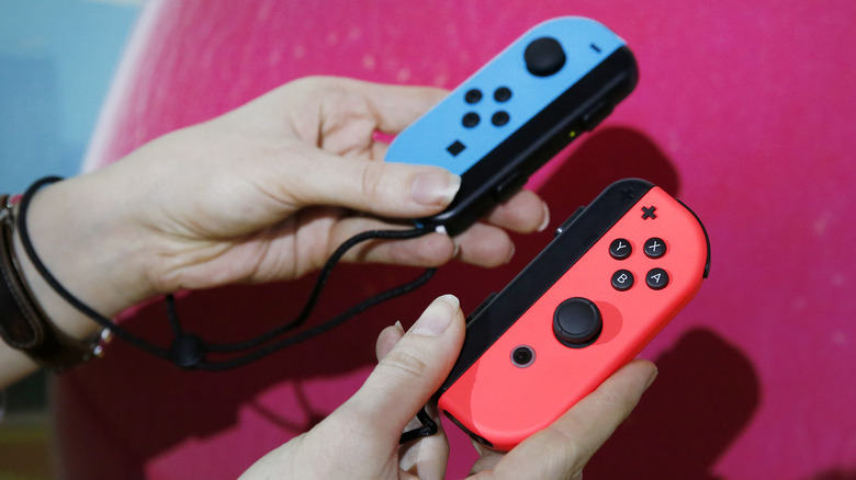 Two Joy-Con controllers being held