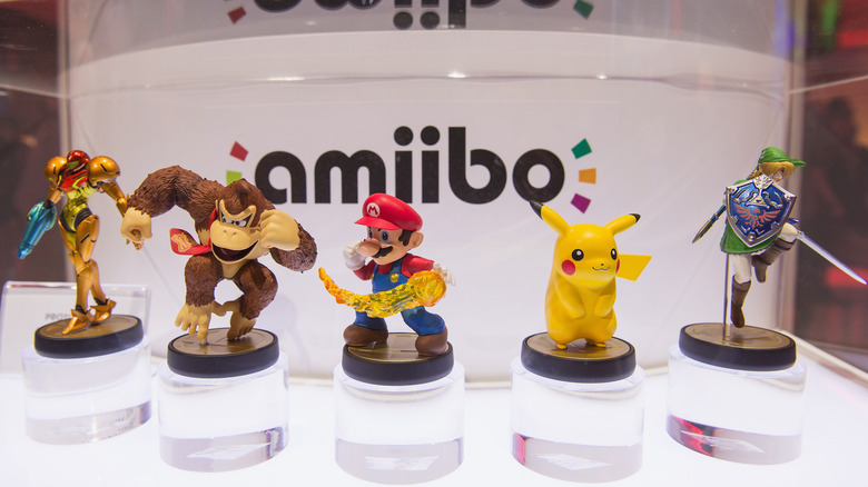 Amiibo figures displayed in a case