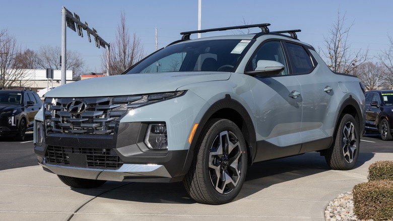 A light gray Hyundai Santa Cruz on a dealership lot