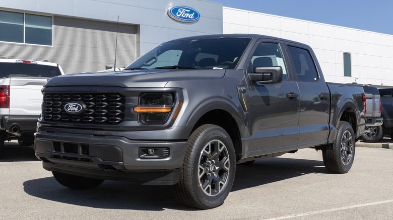 A gray Ford F-150 at a Ford dealership