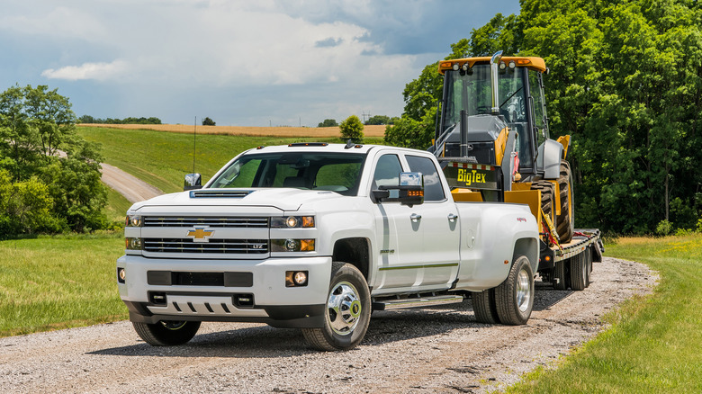 2018 Chevrolet Silverado 3500 HD towing an excavator