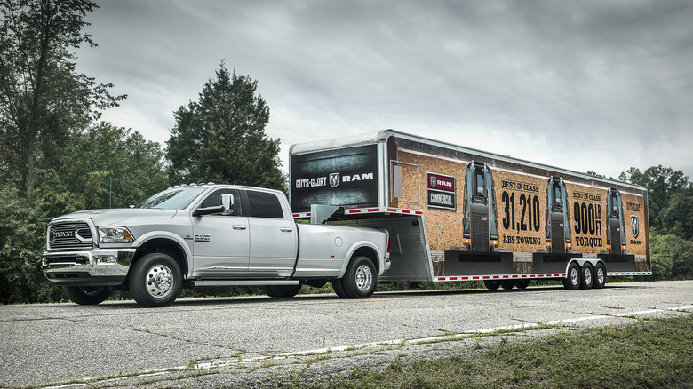 2018 Ram 3500 HD towing a large trailer on an open road