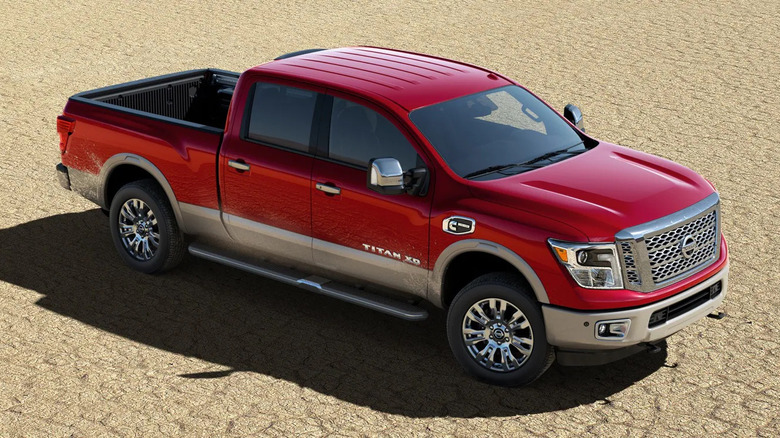 Red 2019 Nissan Titan XD heavy-duty truck on sand