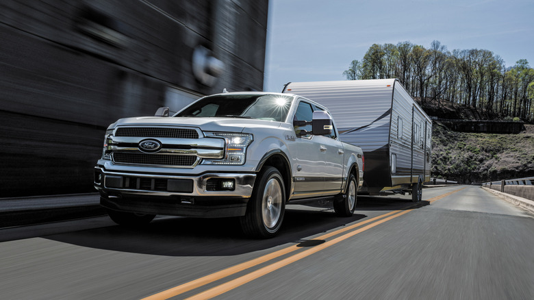 2018 Ford F-150 diesel towing a trailer on an open road