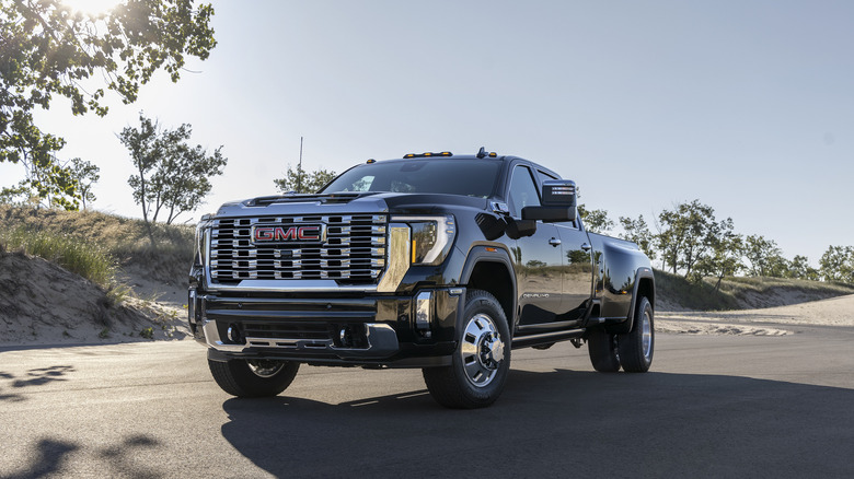 2024 GMC Sierra 3500 HD Denali driving on an open road