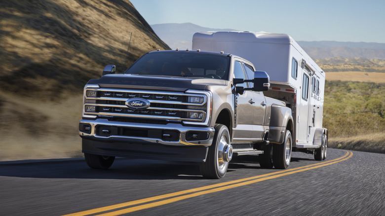 2023 Ford Super Duty F-350 towing a large trailer