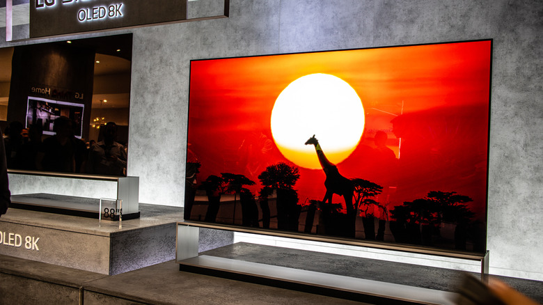 Large-screen TVs on display at a showroom