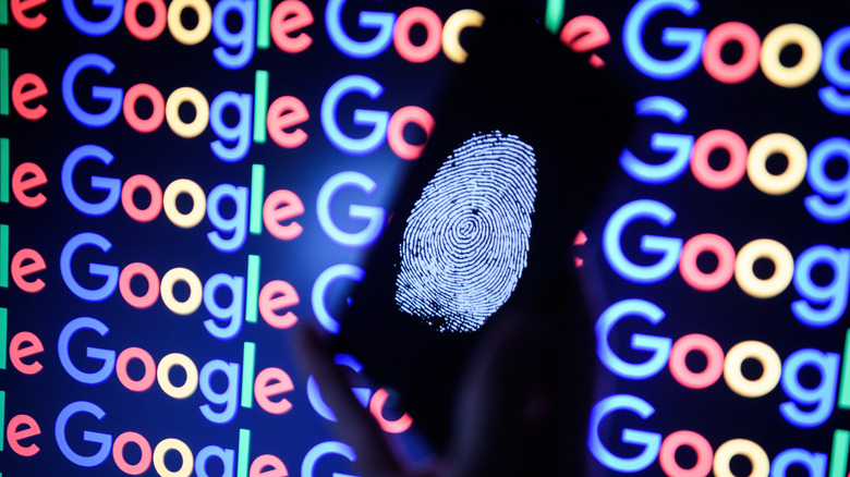 photo of a fingerprint on a phone screen in front of Google logo