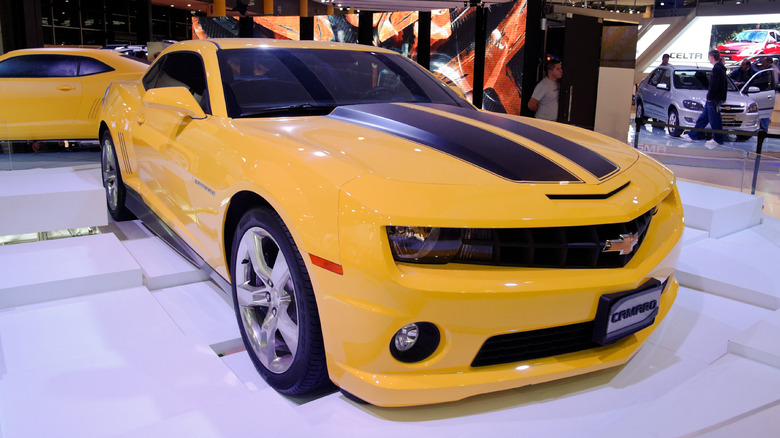 Yellow Chevy Camaro at a car show