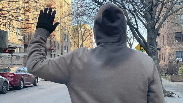 Photo of the motorcycle hand signal for a right turn.