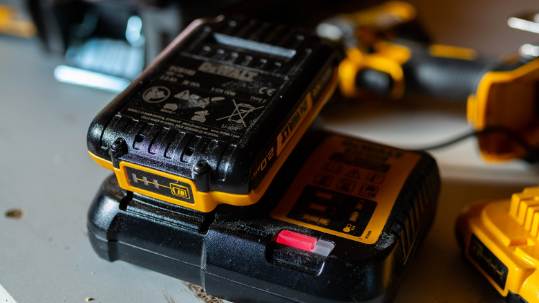 A DeWalt battery on a DeWalt charger.