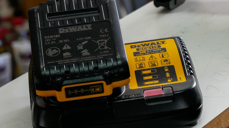 A DeWalt battery on a DeWalt charger.