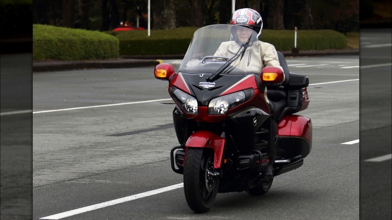 Honda president riding bike