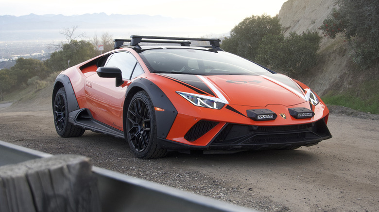 Lamborghini Huracan Sterrato front three quarters with city in the background