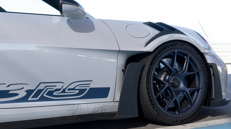 992 Porsche 911 GT3 RS wheel, tire, aero, and track debris