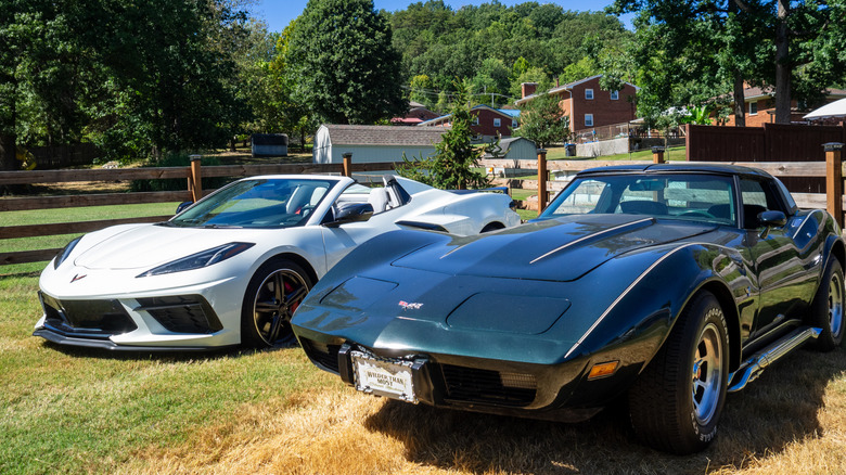 2024 Chevrolet Corvette Stingray Convertible parked next to 1979 Corvette Coupe