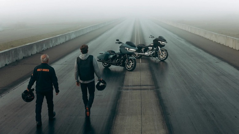 2024 Road Glide motorcycles parked on road with men approaching