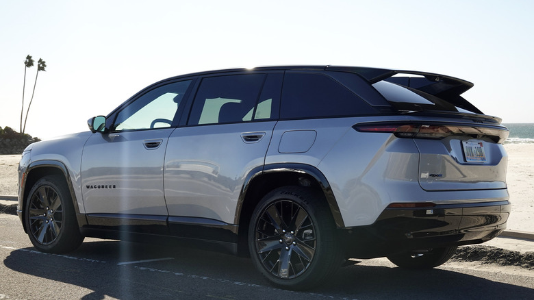 2024 Jeep Wagoneer S EV rear three-quarters by the beach