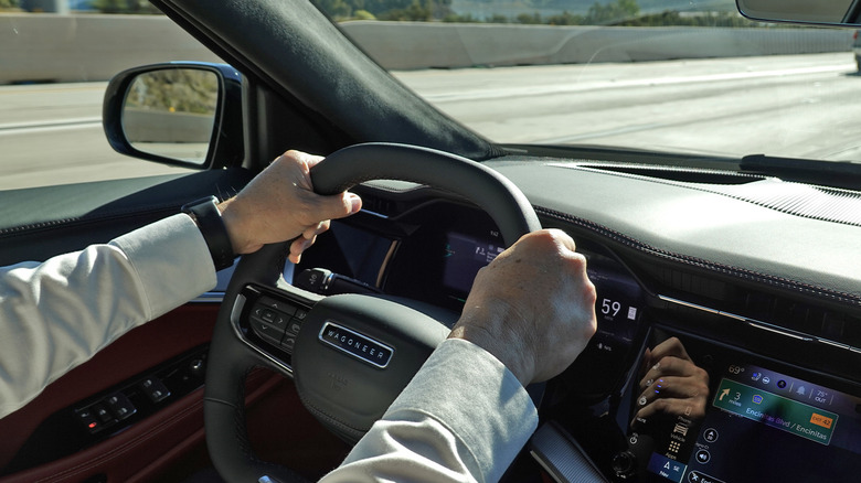 2024 Jeep Wagoneer S EV hands driving on the highway