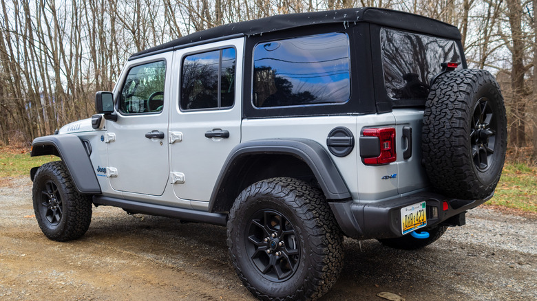 2024 Jeep Wrangler 4xe parked along trees