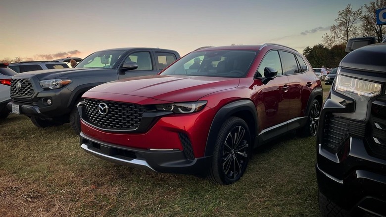 2024 Mazda CX-50 parked on the grass at sunset