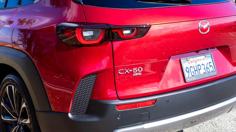 2024 Mazda CX-50 parked on the grass at sunset