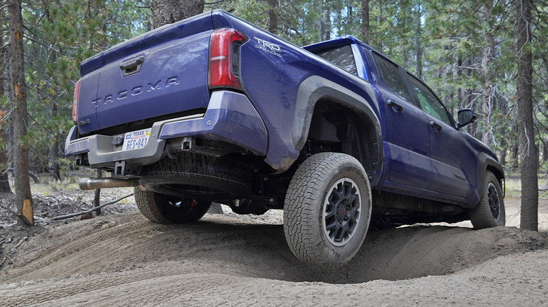 2024 Toyota Tacoma TRD Off-Road manual off-roading with a tire off the ground