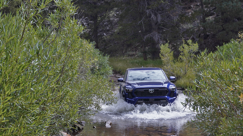 2024 Toyota Tacoma TRD Off-Road manual crossing a stream