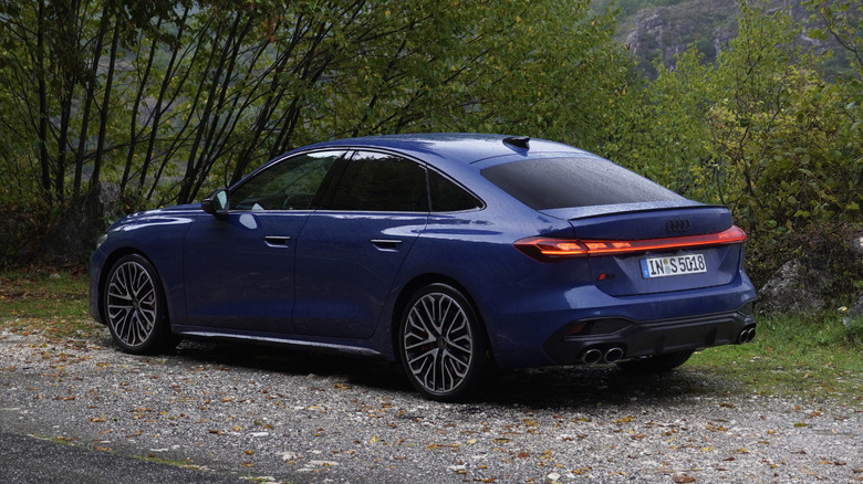 2025 Audi S5 Sedan rear three-quarters in the rain