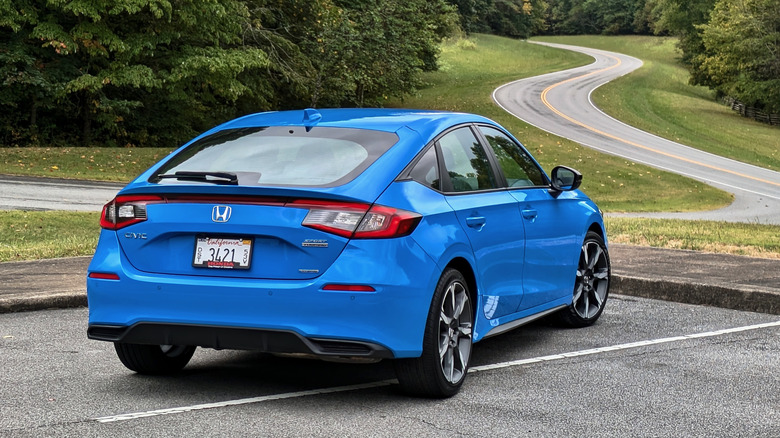 2025 Honda Civic Hatchback Hybrid rear quarter view.