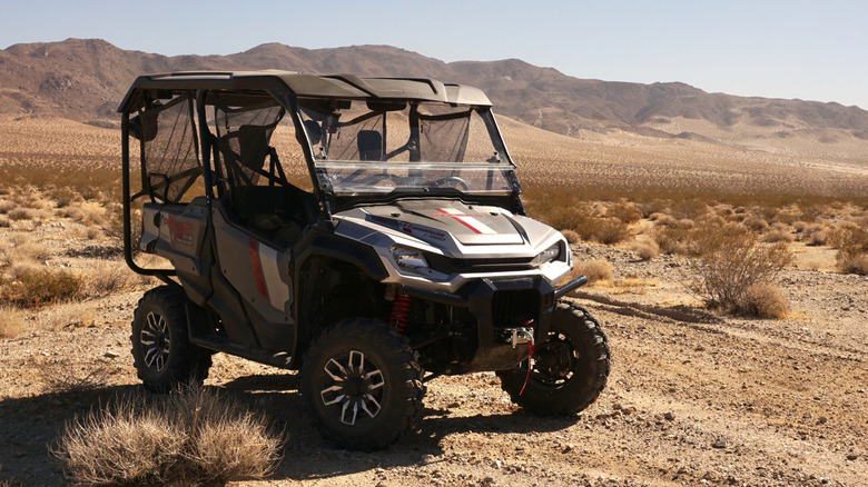 2025 Honda Pioneer 1000-5 parked in the desert