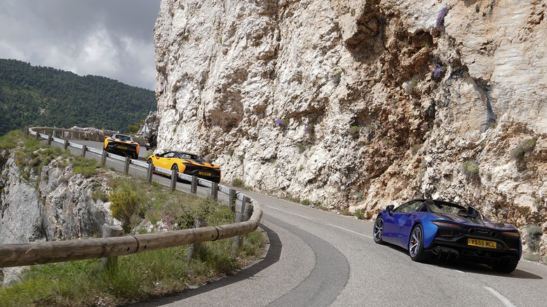 2025 McLaren Artura Spiders driving on the famous road from Goldeneye