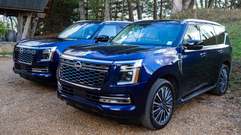 A pair of matching 2025 Nissan Armada Platinum models parked