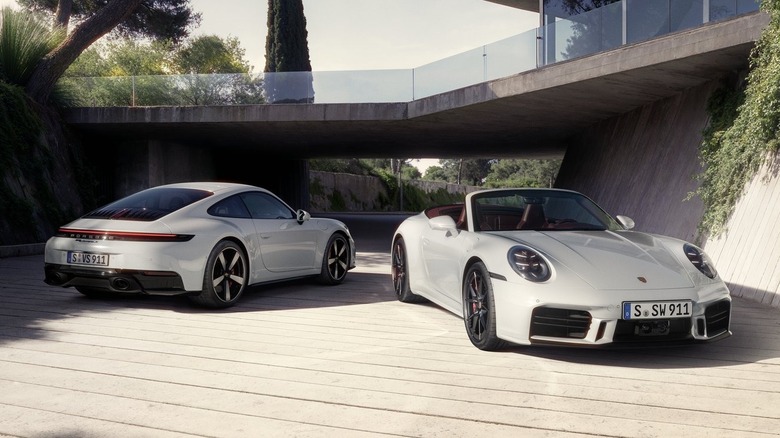 Porsche 911 Carrera S Coupe and Cabriolet parked in driveway